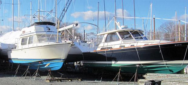 A 1989 Sabreline Fast Trawler and a 2006 Salon Express 38 awaiting the attention of the yard crew at Hartge Yacht Yard in Galesville, MD.