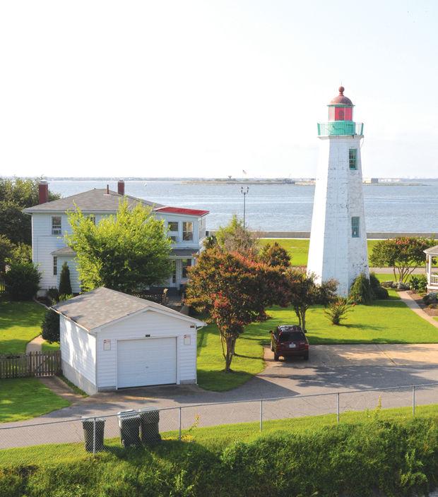 Old Point Comfort lighthouse (built in 1803) with Fort Wool in the background, seen from the walls of Fort Monroe, VA. U.S. Army Environmental Command photo by Neal Snyder
