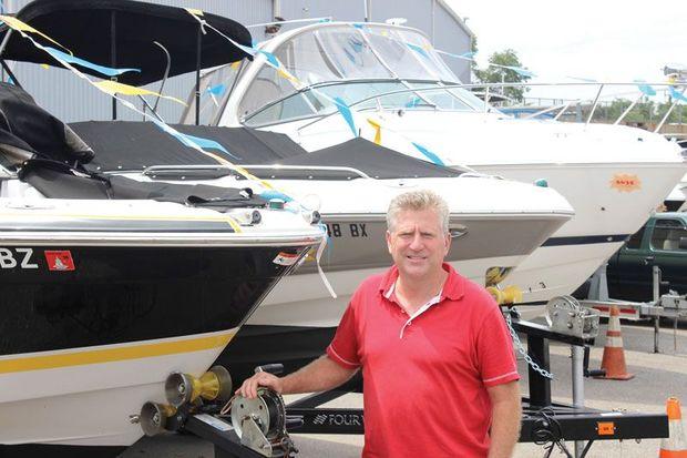 Hawk Ennis of Hawk’s Yachts in Edgewater, MD, with two used boats he bought from a dealer in Ocean City to help replace his depleted inventory. Photo by Rick Franke