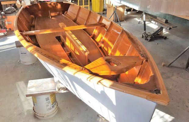 Victoria, a 1960s Penguin class dinghy, hull # 6129, completely rebuilt and restored at Classic Watercraft Restoration in Annapolis, MD.