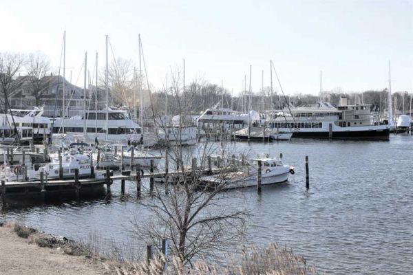 An eclectic mix of workboats, yachts, and commercial tour boats shelter from winter’s blasts in Back Creek in Annapolis, MD. Photo by Rick Franke