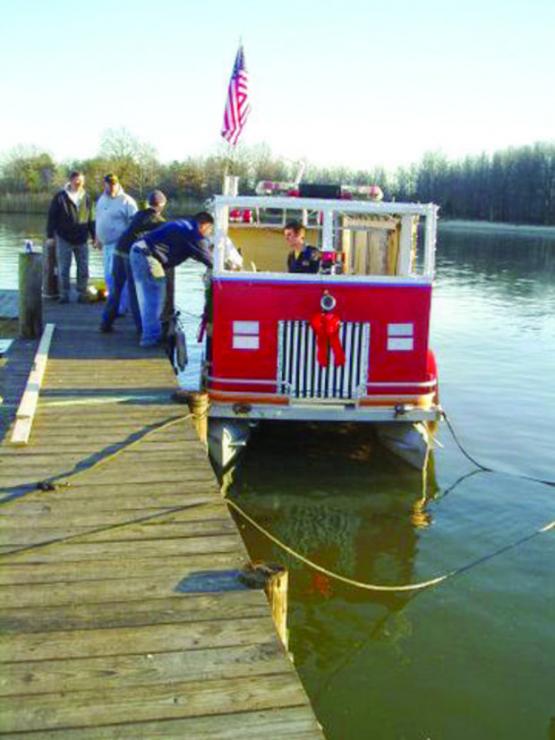 Building a fire truck on a pontoon boat. Crew: Nick, Zach, Doug, Jim, and Joanne Hock with Mr. Pat, and Joe and Greg Bosse.