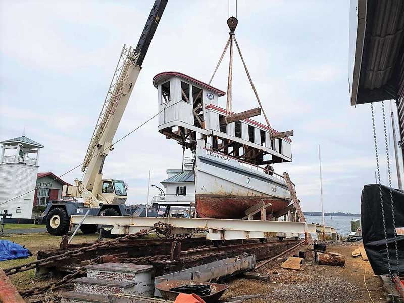 The cabin house of 1912 river tug Delaware is removed from her hull by crane at the Chesapeake Bay Maritime Museum in St. Michaels, MD. 