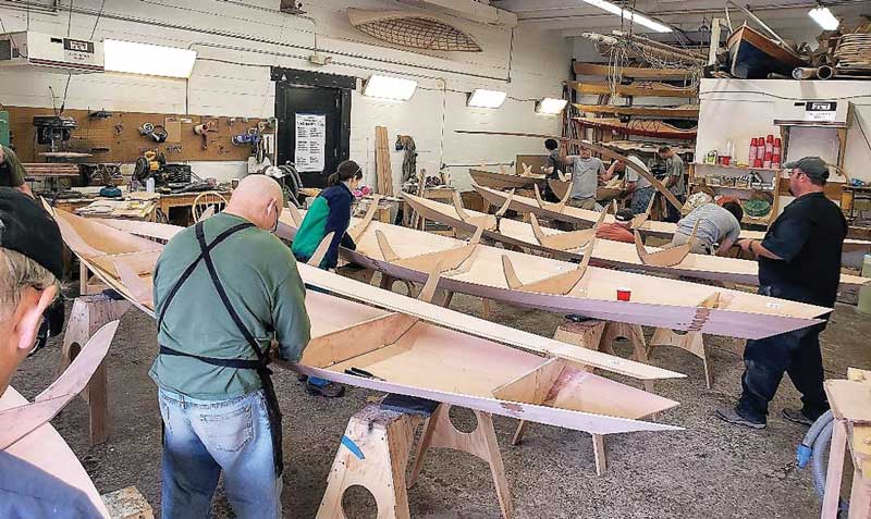 Novice boat builders completing their dories at Chesapeake Light Craft in Annapolis MD.