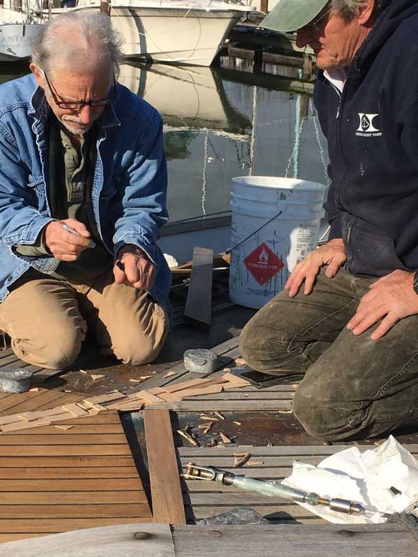 Allen Cady (L) and Peter Bell restoring a teak deck at Hartge Yacht Yard in Galesville, MD.