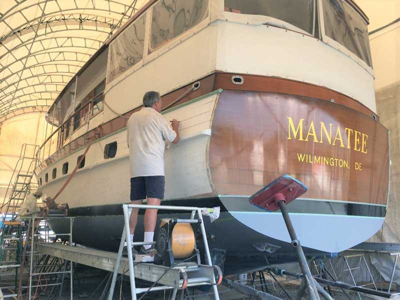 Peter Bell caulking hull seams on the 1950 Trumpy Manatee at Hartge Yacht Yard in Galesville, MD.