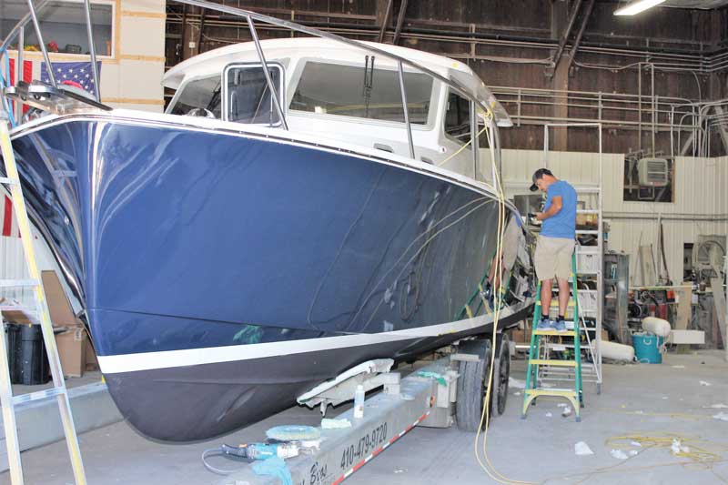 Final details before launching on the fourth Eastport 32 to be built by Mathews Boat Works in Denton, MD. Photo by Rick Franke