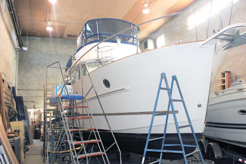 Worth The Wait, a Beneteau 44 trawler, having her varnish work redone at Phipps Boat Works in Deale, MD. Photo by Rick Franke.