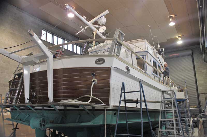 A grand Banks 60 in the shop for woodwork repairs and varnish work at Phipps Boat Works in Deale, MD. Photo by Rick Franke