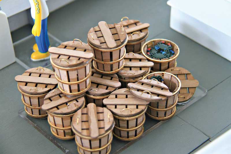 The workboat models can be accessorized with miniature crab baskets, crab traps, nets, and boat hooks.