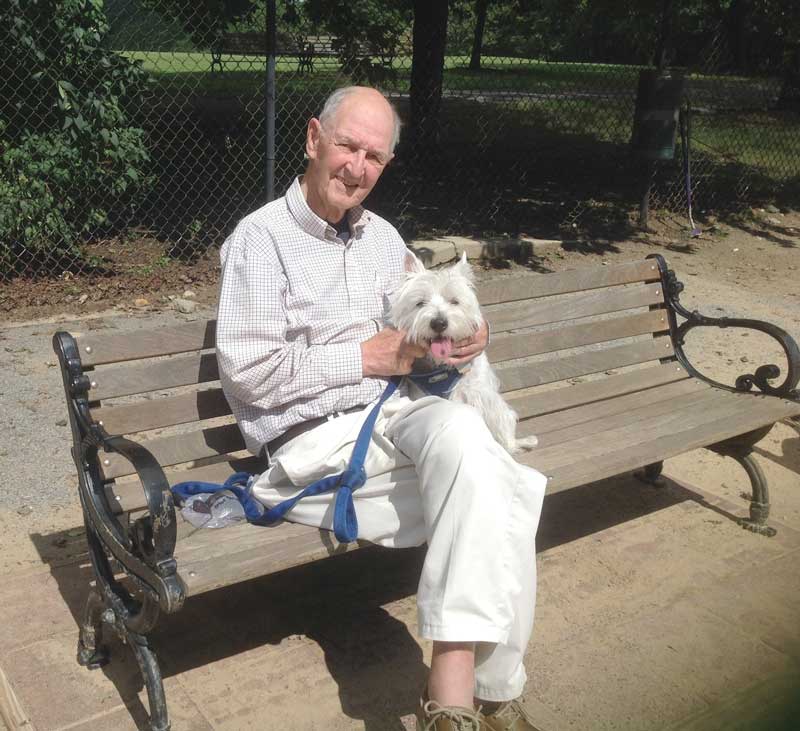 Wally Stone rests for a moment with his dog while at Quiet Waters Park. Photo courtesy of Cindy Murphy