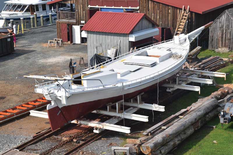 The restored 1889 bugeye Edna Lockwood awaiting her masts on the railway at the Chesapeake Bay Maritime Museum in St. Michaels, MD.