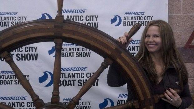 Brooke King takes the helm at the Atlantic City Boat Show. Photo by Ken Hadley