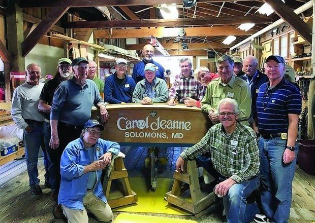 The dedication of Carol Jeanne, an electric powered crab skiff, in the boat shop at Calvert Marine Museum in Solomons, MD.