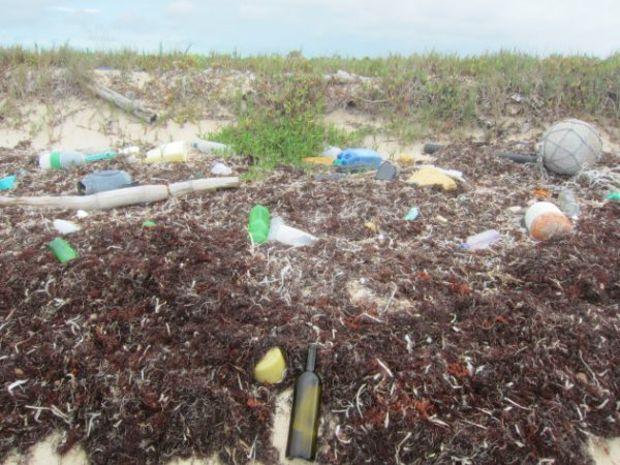 In his explorations for bottles, Clint was awakened to the sheer volume of plastic pollution on our beaches. Photo courtesy Message in a Bottle Hunter