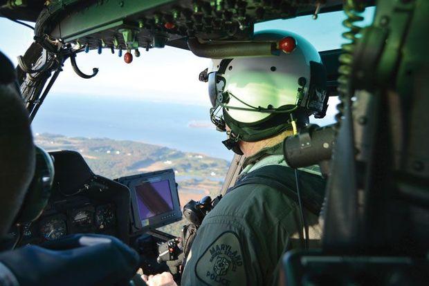 NRP pilot Sgt. John Buchanan at the controls of Natural 1 during an oyster patrol over the lower Eastern Shore. Photo courtesy of Maryland Natural Resources Police