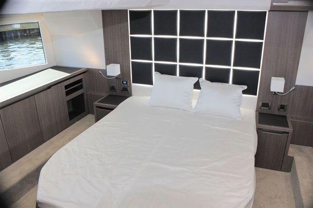 The midship, full beam, owners state room with a centerline queen size bed.