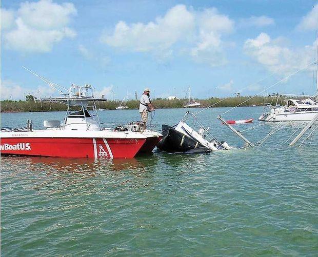 The BoatUS catastrophe team at work clearing sunken boats from Boot Key Harbor, FL. Photo by BoatUS