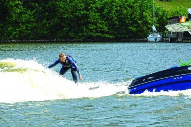 Jen Pratt surfing a wave behind the Mastercraft X30. Jen Pratt surfing a wave behind the Mastercraft X30.