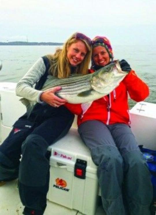 Lizzie Geiss and Regina Welsh show off a nice catch on opening day at the Boatyard Bar &amp; Grill Tournament. Photo by Tom Weaver